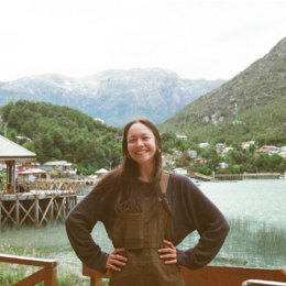 Sarah standing in front of a body of water