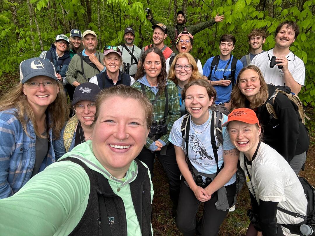 Audubon Vermont staff and guests hudled together to take a selfie.